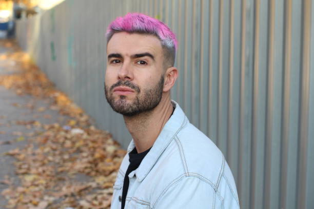 istock Headshot of handsome pink haired young man 953516914