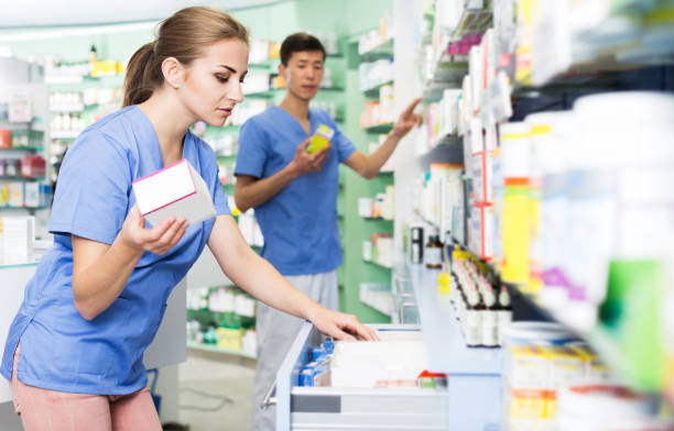 istock Pharmacist looking medicines in lockers 953519092