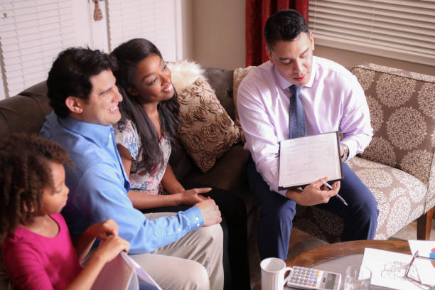 istock Multi-ethnic family meets with financial advisor. 953519810
