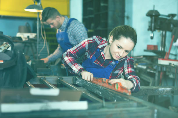 istock woman is working with level 953520058