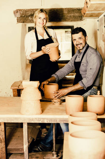 istock two potters working with ceramics in atelier 953521532