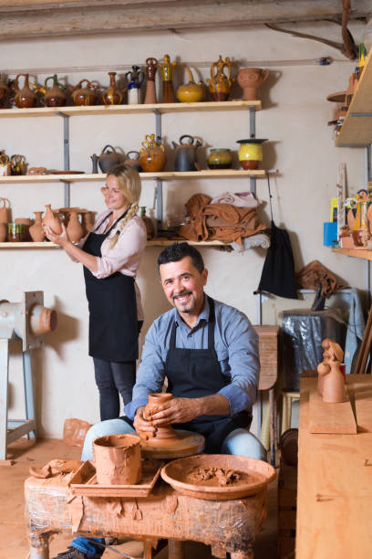 istock two potters working with ceramics in atelier 953521592