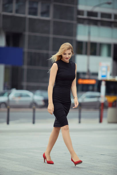 istock Pretty girl walking on the street from work 953524010