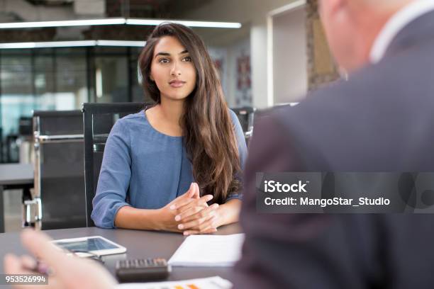 Focused Indian Female Customer Meeting With Financial Advisor Stock Photo - Download Image Now