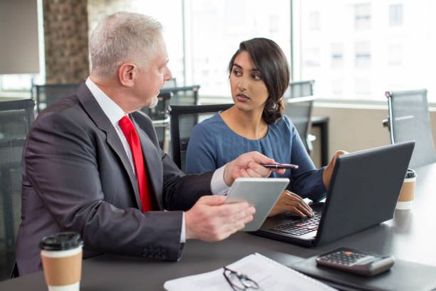 istock Two business colleagues working together in meeting space 953527238
