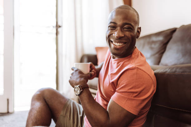 istock man sitting at home in the living room 953534672