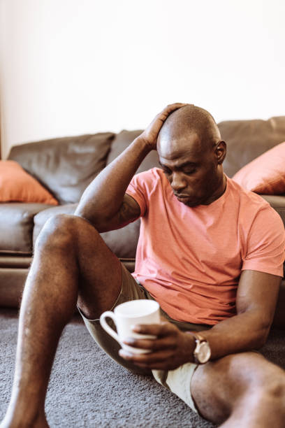 istock man sitting at home in the living room 953534794