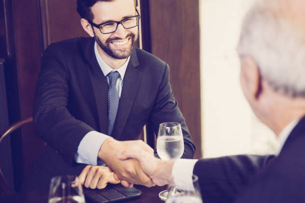 istock Businessman Shaking Hands with Partner 953534894