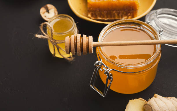 istock Various types of honey on wooden platter, closeup 953538372