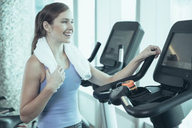 istock Smiling young woman relaxing after training in gym 953559688