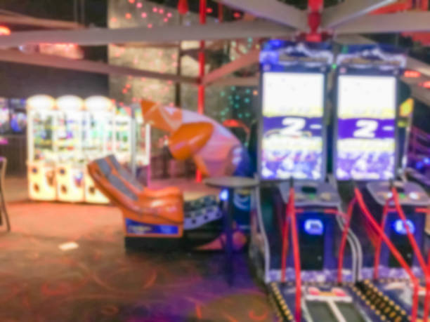 istock Blurred arcade game room at entertainment complex in America 953559718