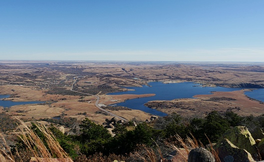 Panoramic shot of medicine Park with Lake Lawtonka in the Comanche County, Oklahoma viewed from the peak of Mt. Scott.