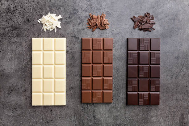 istock Delicious variety of chocolate on rustic background 953577736
