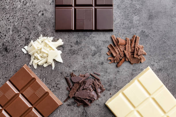 istock Delicious variety of chocolate on rustic background 953578364