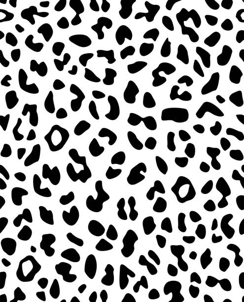 Leopard seamless skin pattern. For use in printing or for fabric. Leopard seamless skin pattern. For use in printing or for fabric. Black and white vector illustration. dalmatian stock illustrations