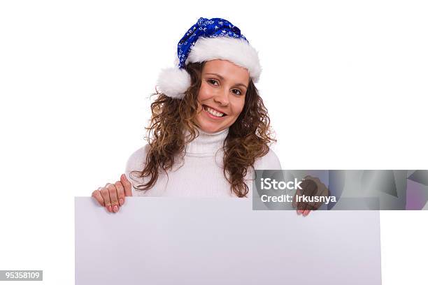 Женщина В Рождественские Cap Держит Пустой Информационных — стоковые фотографии и другие картинки Баннер - знак