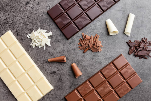 istock Delicious variety of chocolate on rustic background 953582320