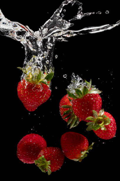 istock Fresh strawberries are dropped into water. 953582844