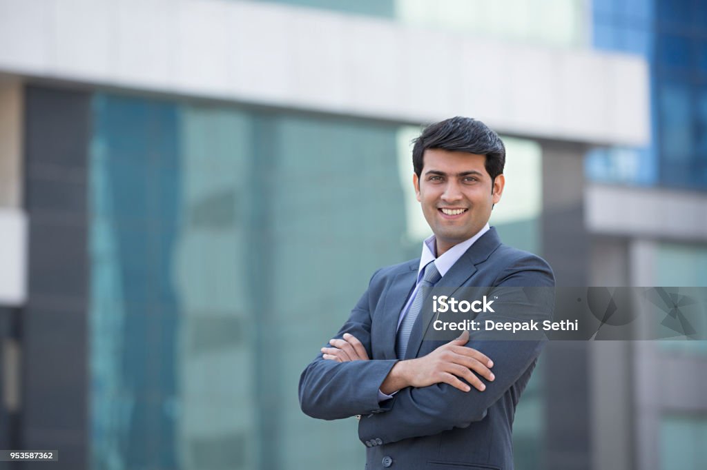 Businessman Standing With His Arms Folded - Stock image Businessman, Men, Professional Occupation, Suit Indian Ethnicity Stock Photo