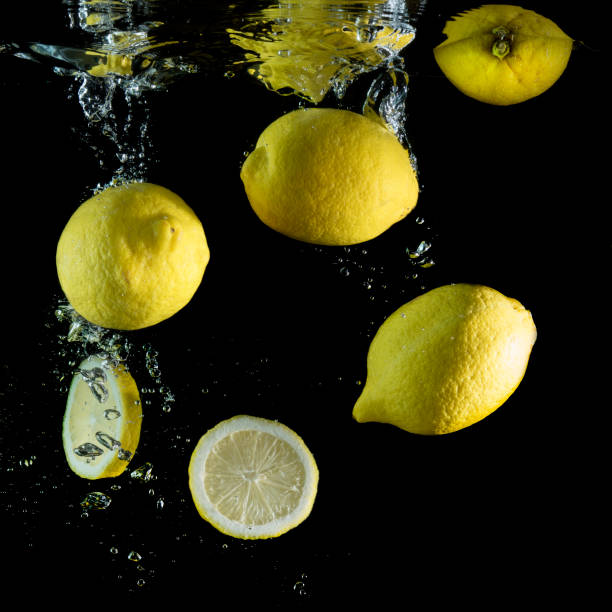 istock Fresh lemons are dropped into water. 953587962