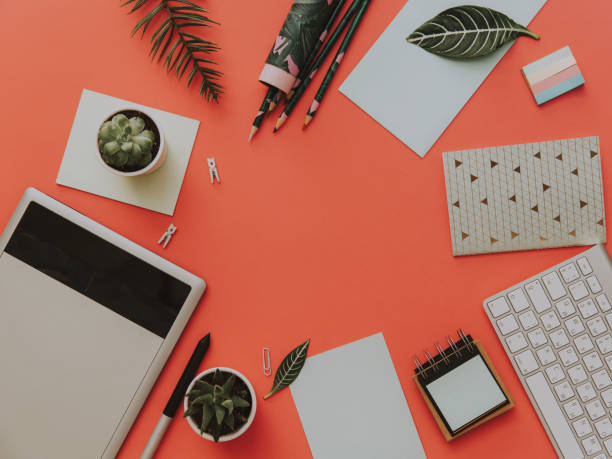 istock Flat Lay office desk work space with graphic tablet, keyboard, headphones on pastel. Creative Designer concept. 953592822