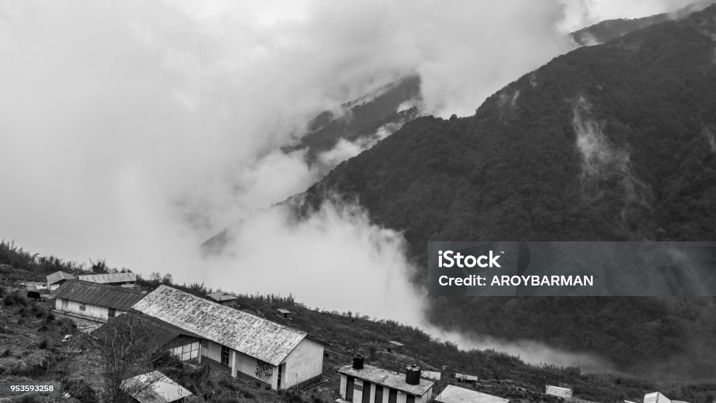 Zuluk A hilltop View of beautiful misty mountain range with zuluk village. Asia Stock Photo