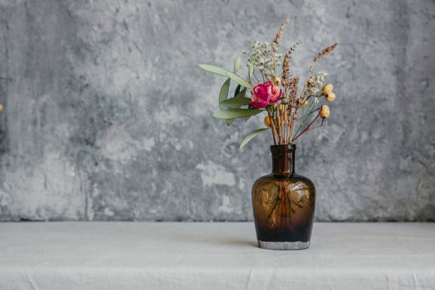 istock Dried flower in bottle, minimalism in still life. Copy space background 953596468