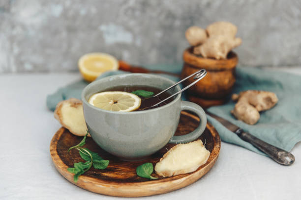 istock Hot tea with lemon and fresh ginger on rustic scene. 953597164