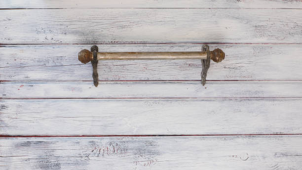 istock old iron hanger on a wooden wall 953598782