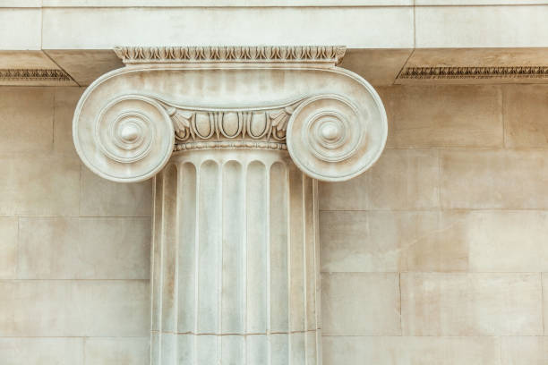 Decorative detail of an ancient Ionic column Close up Decorative detail of an ancient Ionic column ionic stock pictures, royalty-free photos & images