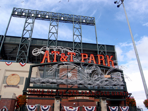San Francisco - April 7, 2009: AT&T Park - Home of the Giants - Neon Sign during day with visual of baseball splashing into the water as people enter park for ballgame taken on April 7, 2009 at Att Park in San Francisco California.