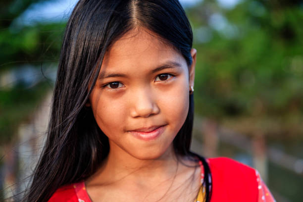 Portrait of happy Vietnamese young girl, Mekong River Delta, Vietnam Portrait of happy Vietnamese young girl, Mekong River Delta, Vietnam vietnamese culture stock pictures, royalty-free photos & images