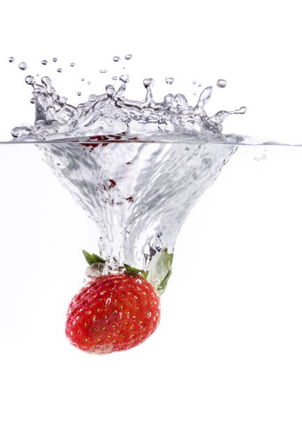 plunge of a strawberry in fresh water
