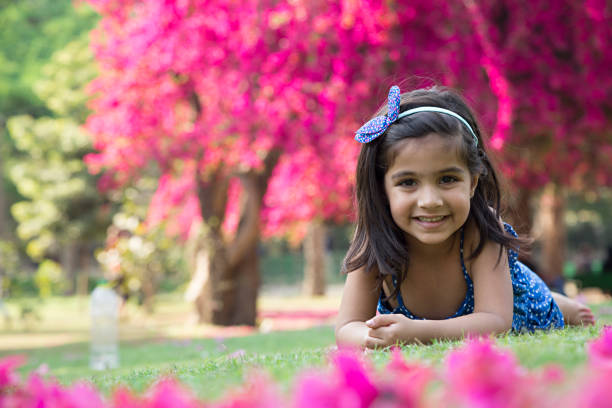 istock Girl is lying at park - Stock image 953605494