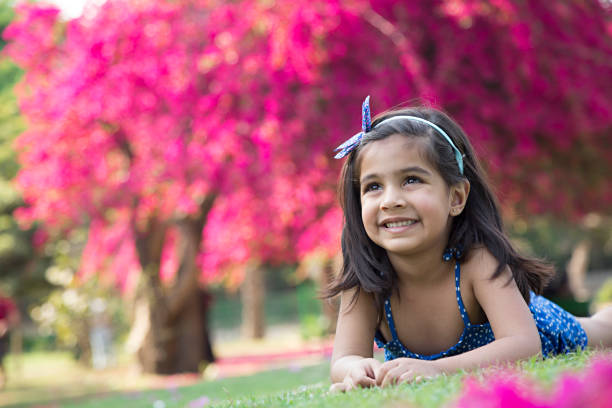 istock Girl is lying at park - Stock image 953606332