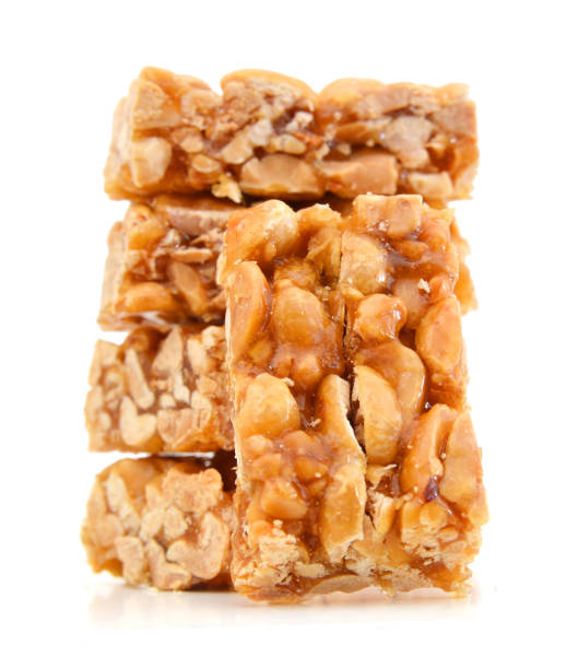 istock peanut in a sugar syrup (caramel) on a white background 953611504