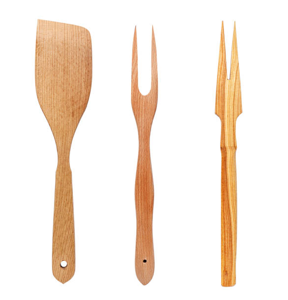 istock wooden spatula and fork on a white background 953612240