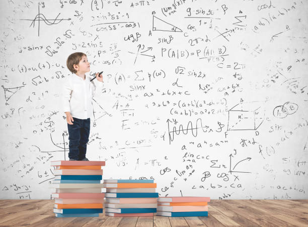 istock Cute little boy with a marker, science formula 953616368