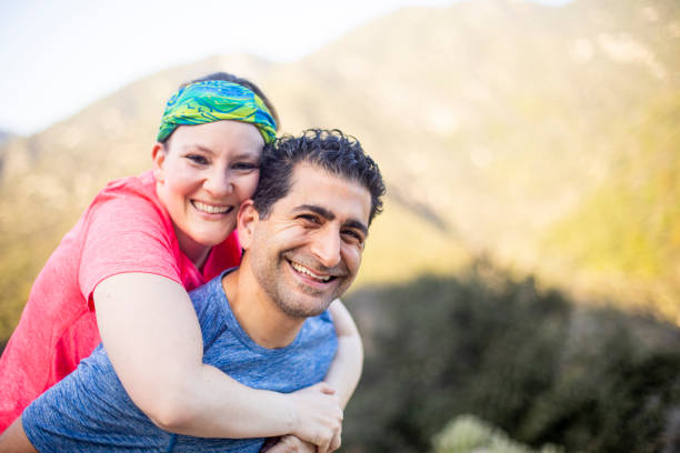 istock Diverse Couple Piggyback Ride 953616396
