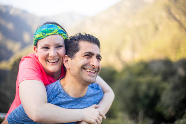 istock Diverse Couple Piggyback Ride 953616600