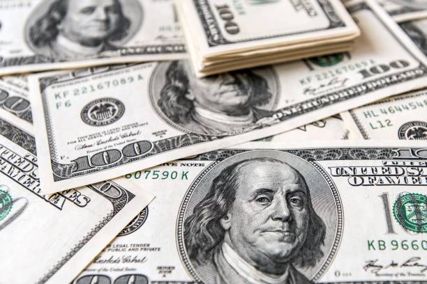 istock Close Up of Stack of dollars as background 953620852