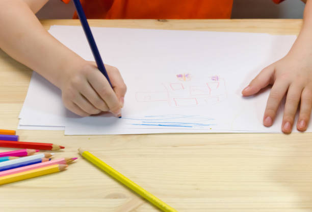 istock children's hands draw drawing with pencils 953627560