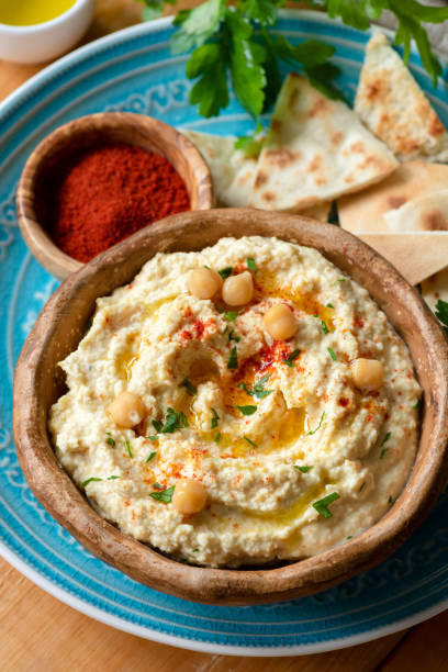 istock Chickpea hummus with paprika and pita chips 953628224