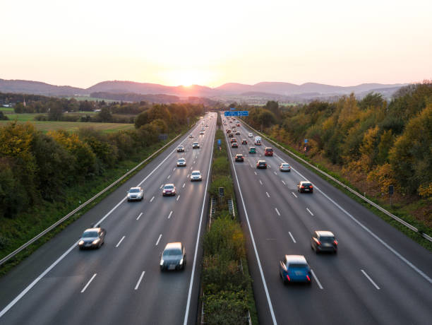 istock The road traffic on a motorway at sunset 953628230