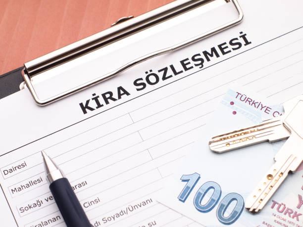 Rental agreement in Turkish Rental agreement in Turkish, keys and a pen on it. lease agreement stock pictures, royalty-free photos & images