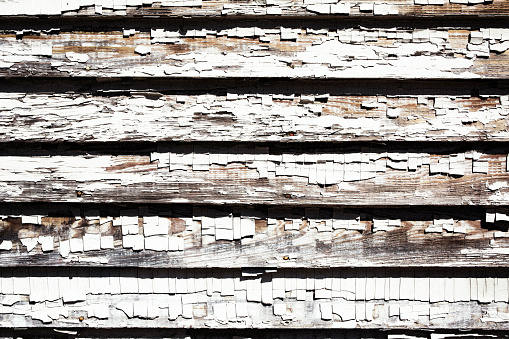 Background texture of blue wooden wall made of slats with gray chipped paint