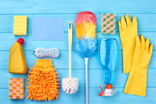 istock House cleaning set on wooden background. 953633950
