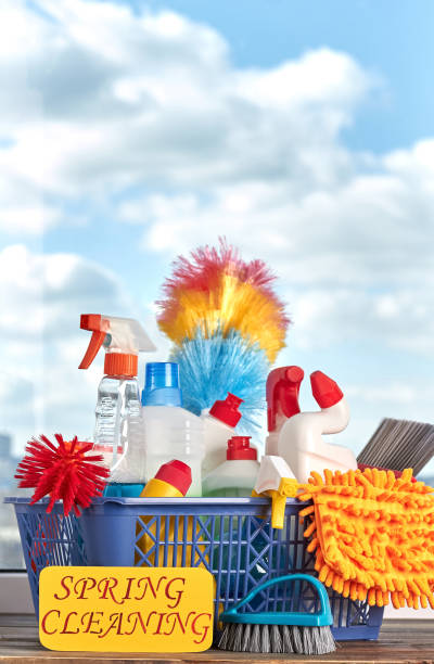 istock Cleaning supplies on blue sky background. 953636312