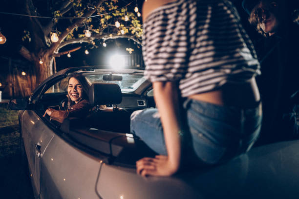 istock Young people having party in convertible 953638016
