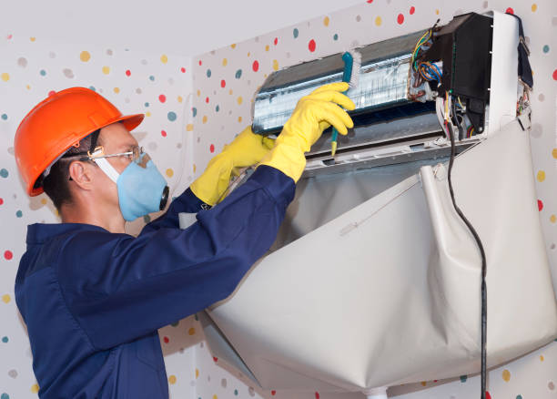 professional worker cleans the air conditioner professional worker cleans the indoor unit of the air conditioner electrolux oven repair stock pictures, royalty-free photos & images